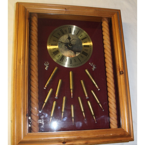 137 - Mounted wall clock with cartridge display including 243 WIN 30/06 spring etc all inert 40cm x 50cm