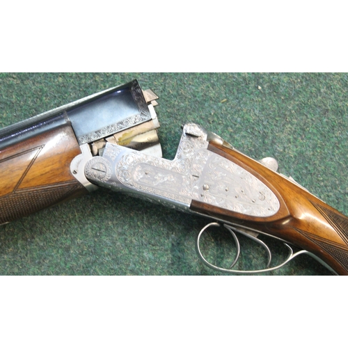 305 - 12B Armitalia di Luccchini, over-under double trigger ejector shotgun, engraving to lock, barrel len... 