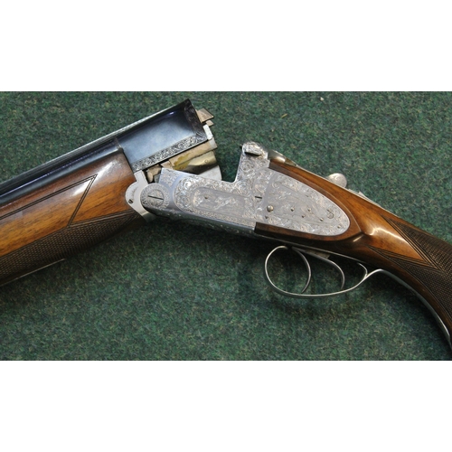 305 - 12B Armitalia di Luccchini, over-under double trigger ejector shotgun, engraving to lock, barrel len... 