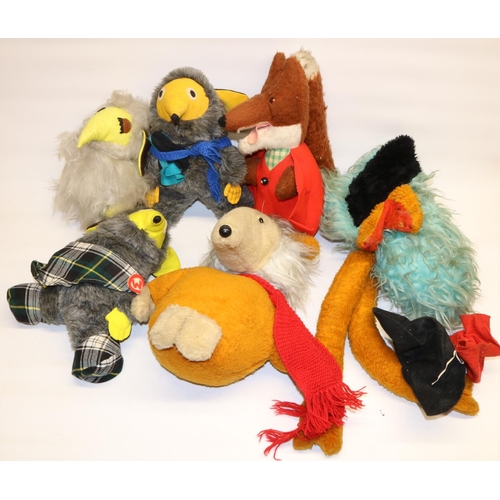 81 - Group of c1970s TV tie-in soft toys, comprising four Wombles, Basil Brush, and an emu (6)