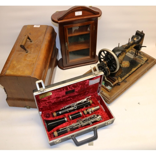 1284 - Jones walnut cased hand operated sewing machine serial no.314271, wall cabinet and a cased Boosey & ... 