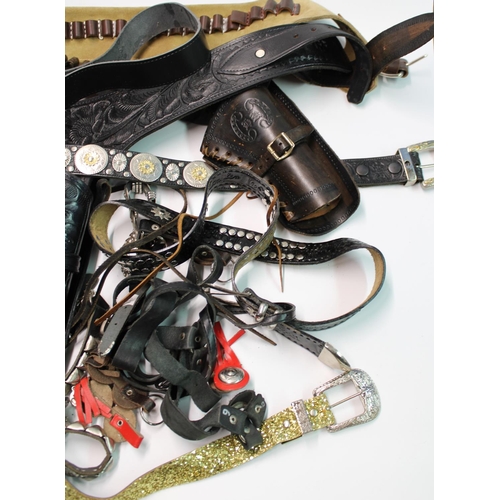 1410 - Collection of wild west themed dress accessories incl. gun belts, spurs, holsters etc. (qty)