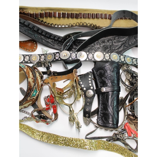 1410 - Collection of wild west themed dress accessories incl. gun belts, spurs, holsters etc. (qty)