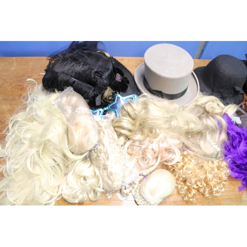 1417 - Selection of ladies and gentleman's hats incl. top hat and bowler together with feather boas, wigs, ... 