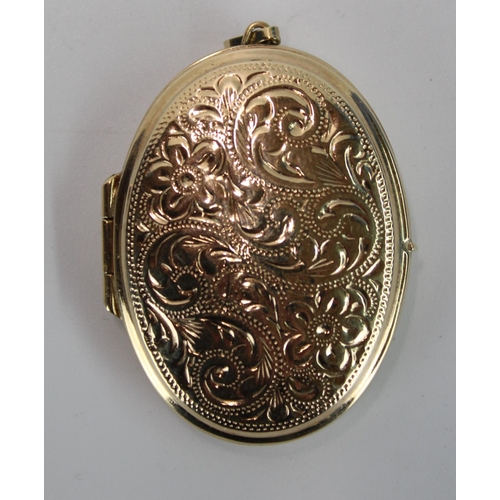 1439 - Hallmarked 9ct gold locket with engraved foliate decoration, 8.4g, H4.6cm