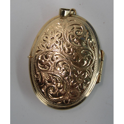 1439 - Hallmarked 9ct gold locket with engraved foliate decoration, 8.4g, H4.6cm