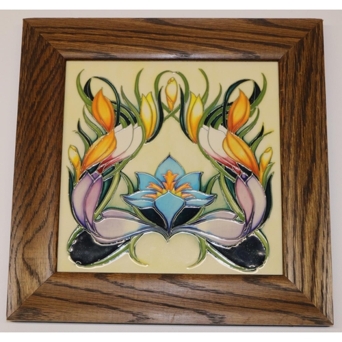 1381 - Moorcroft Pottery: framed plaque designed by Philip Gibson, tube lined floral decoration, dated 2004... 