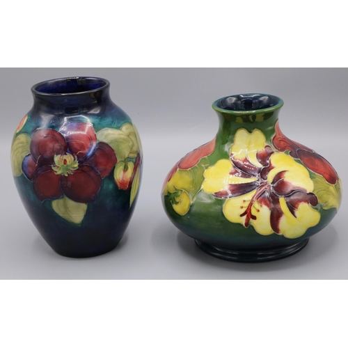 1386 - Moorcroft Pottery: Hibiscus design squat form vase, yellow and purple flowers on green ground, H11cm... 