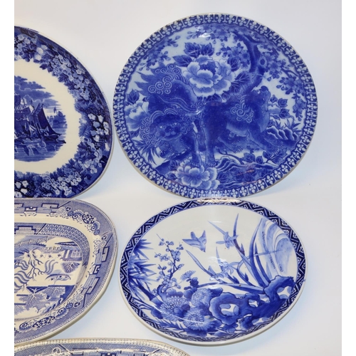 583 - Group of blue and white ceramics, comprising a Japanese painted charger decorated with a bird amongs... 