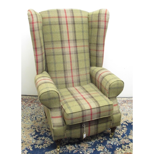 670 - Metro Furniture Geo.111 style wing back arm chair, upholstered in  green tartan on turned legs with ... 