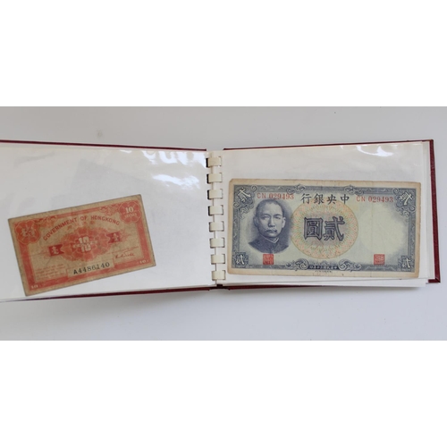 877 - Wad of all world banknotes together with a small booklet of Far East banknotes incl. Hong Kong, Chin... 