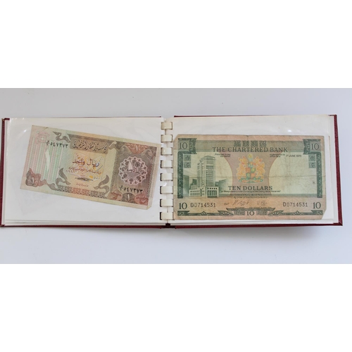 877 - Wad of all world banknotes together with a small booklet of Far East banknotes incl. Hong Kong, Chin... 