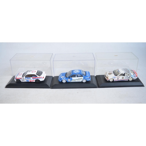 81 - Eight 1/43 scale diecast car models by Minichamps to include touring cars, a Generation VW Golf and ... 