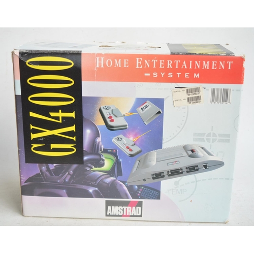 103 - Amstrad GX4000 home video console system with 2 hand controllers, power supply, instructions and Bur... 