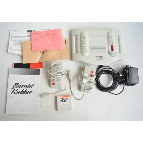 103 - Amstrad GX4000 home video console system with 2 hand controllers, power supply, instructions and Bur... 