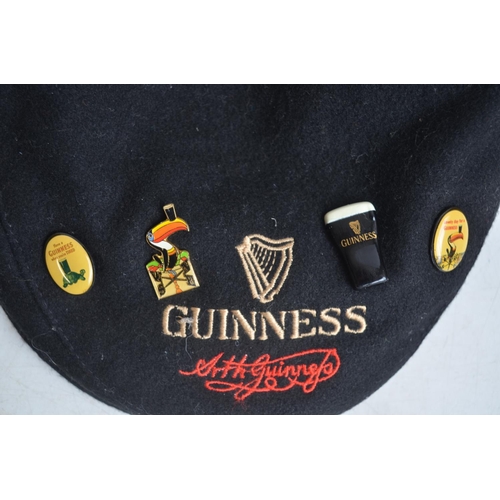 99 - Collection of Guinness related ephemera to include an Extra Stout mirror (58.3x48cm), a harmonica, b... 