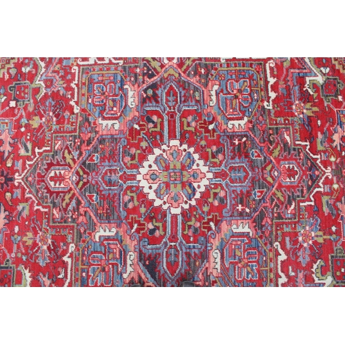 549 - C20th Belgian Louis Poortere Heriz pattern red ground rug, 344cm x 241cm