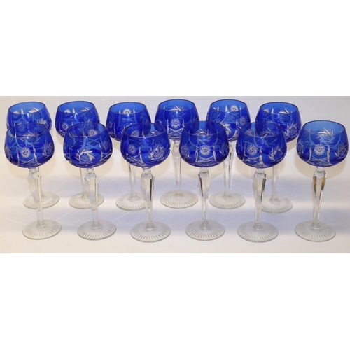 696 - C20th twelve Bohemian lead crystal hock glasses with blue overlay and incised cut decoration