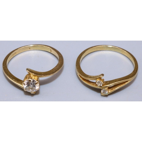 857 - Two yellow metal twist crossover rings set with diamonds, size H and J1/2, 3.5g