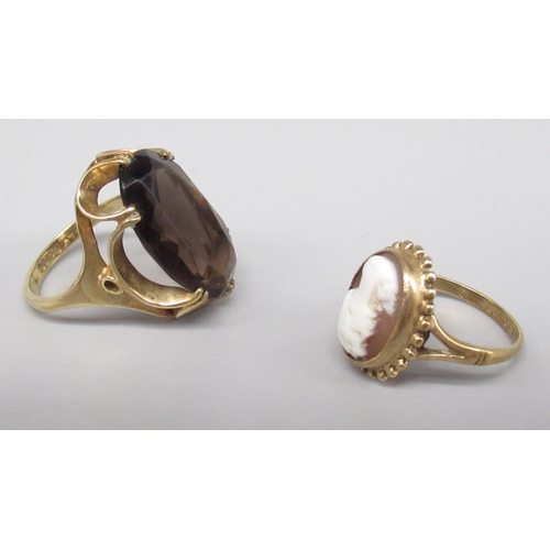 28 - 9ct yellow gold ring set with large smokey topaz, stamped 375, size O, and a 9ct gold cameo ring, st... 