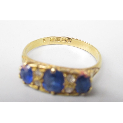 4 - 18ct yellow gold diamond and sapphire ring, with three oval cut sapphires separated by brilliant cut... 