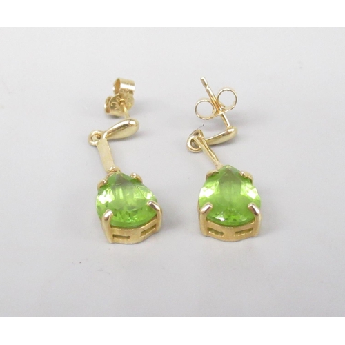 8 - 9ct yellow gold drop earrings set with pear cut peridot, stamped 375, 3.3g
