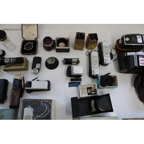 172 - Selection of miniature cameras and selection of camera lenses, accessories, filters, light meters, r... 