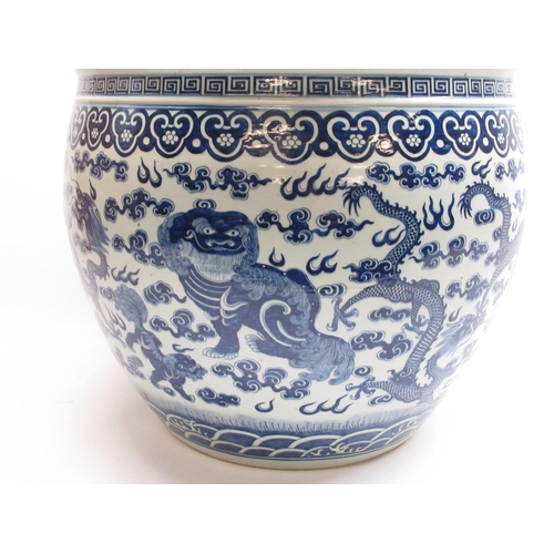 550 - Large blue and white Chinese fish bowl jardiniere, painted in underglaze blue with  dragons and foo ... 