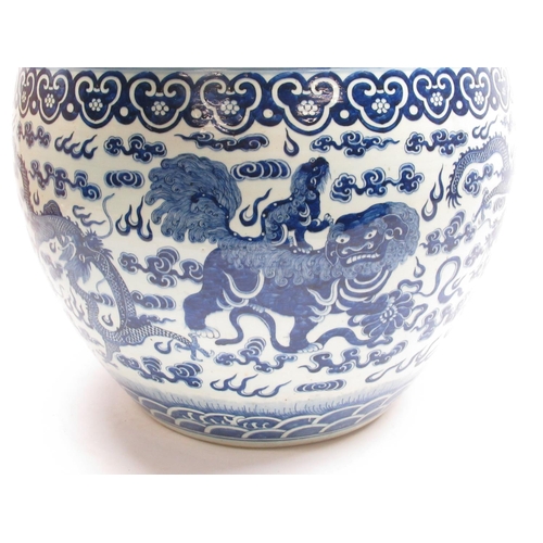 550 - Large blue and white Chinese fish bowl jardiniere, painted in underglaze blue with  dragons and foo ... 