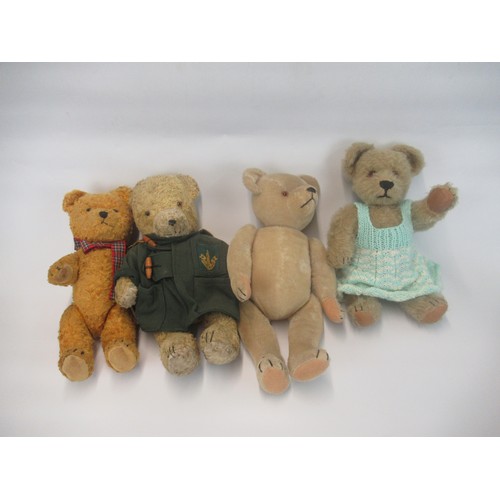 1345 - Four early C20th and later British teddy bears, one in a green duffel coat (4)