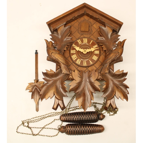 520 - Hubert Herr, Triberg, Germany - Late C20th Black Forest Cuckoo clock, stained and carved light wood ... 