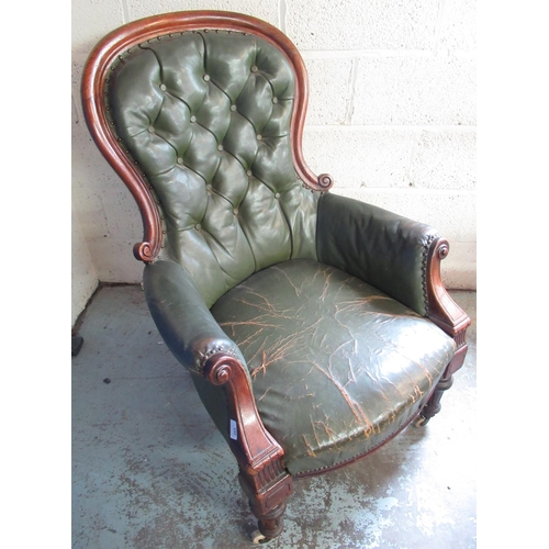 265 - Victorian button back mahogany framed arm chair, upholstered in green leather, on turned supports wi... 