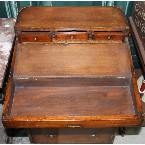 261 - C20th brass bound mahogany Campaign style writing desk, with folding leather lined top above drawers... 