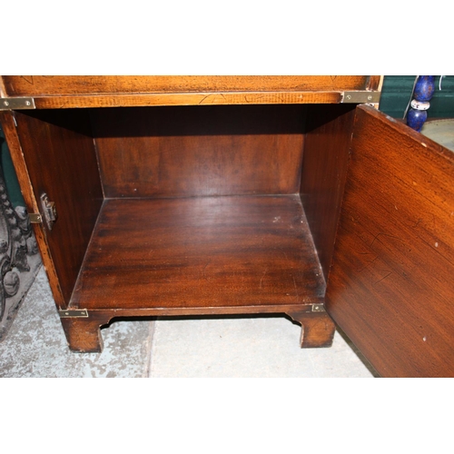 261 - C20th brass bound mahogany Campaign style writing desk, with folding leather lined top above drawers... 