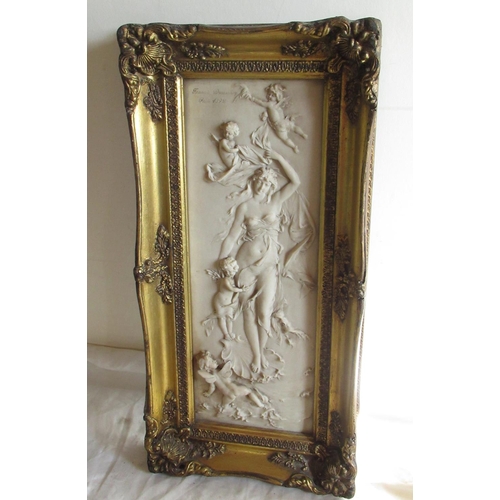 628 - After Francois Dequemsy, a reconstituted marble rectangular relief plaque of Cupid in gilt square fr... 