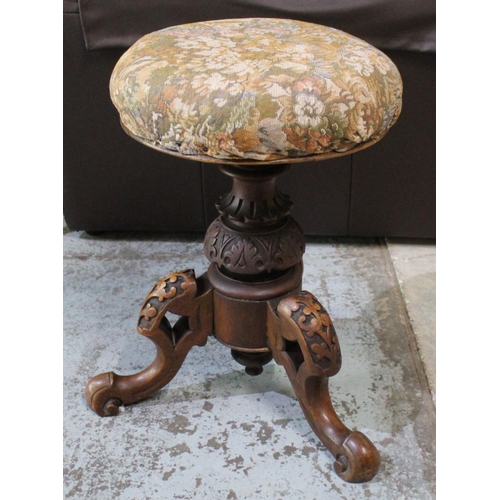 760 - Victorian walnut tripod music stool upholstered top on three carved supports, H51cm