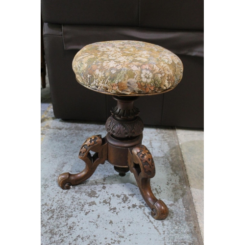 760 - Victorian walnut tripod music stool upholstered top on three carved supports, H51cm