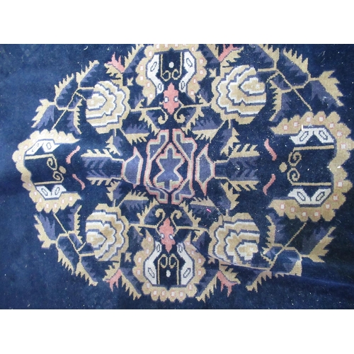 284 - Blue ground Chinese carpet, with central stylized floral medallion in similar repeating border, appr... 