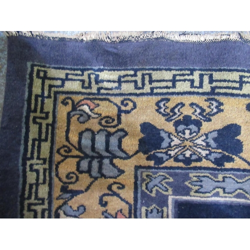 284 - Blue ground Chinese carpet, with central stylized floral medallion in similar repeating border, appr... 