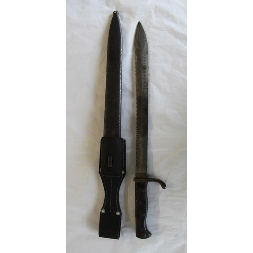 692 - WWI German Butcher Bayonet Sword. With no viable markings. In original scabbard with later replaceme... 