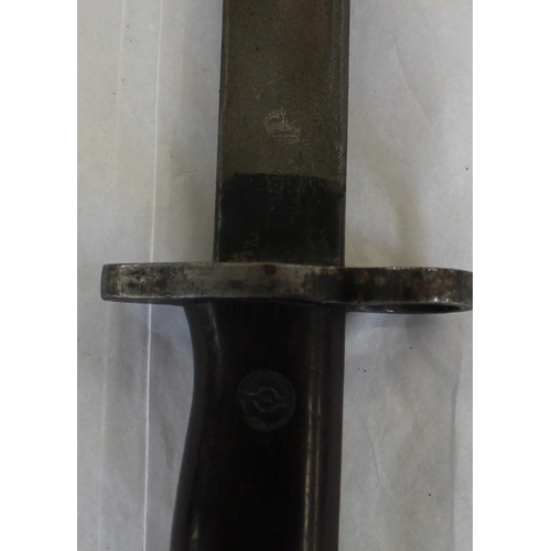 694 - WWI 1907 pattern SMLE sword bayonet in original leather scabbard with markings on the ricasso. Blade... 