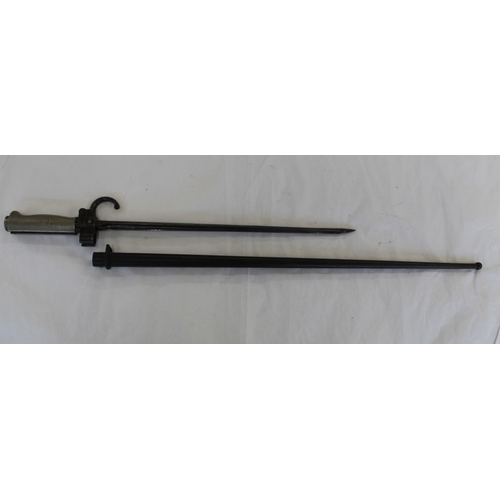 696 - French 1886 pattern Lebel Rifle Bayonet. Numbers on quillon. in original scabbard. The blade has bee... 