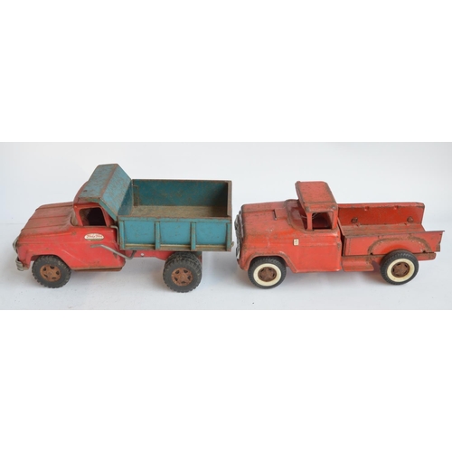 169 - Two vintage pressed steel pick up truck models to include a Tonka Toys dump truck (in working order)... 