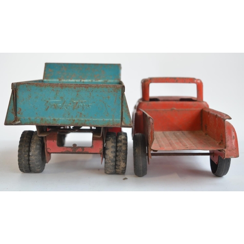 169 - Two vintage pressed steel pick up truck models to include a Tonka Toys dump truck (in working order)... 