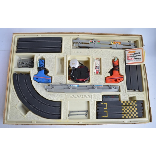 173 - Collection of car models and games to include vintage Matchbox Le Mans Powertrack 4000 slot car set ... 