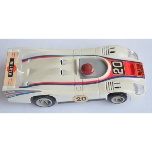 173 - Collection of car models and games to include vintage Matchbox Le Mans Powertrack 4000 slot car set ... 