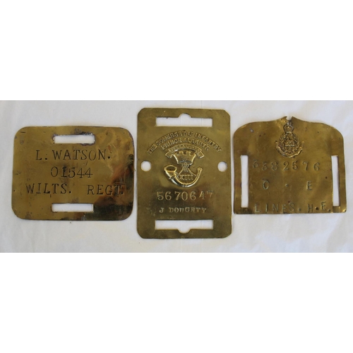 676 - Three brass duty/bed plates. Wiltshire Regt, Somerset Lt Infantry and the East Lancashire Regt