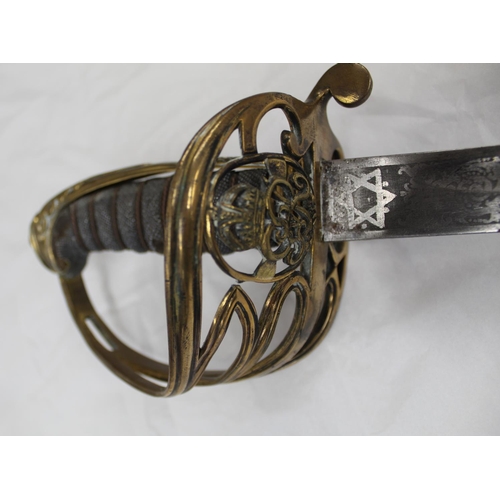 702 - George V Officers dress sword. Ball pommel and wire bound shagreen grip. Engraved steel blade with R... 