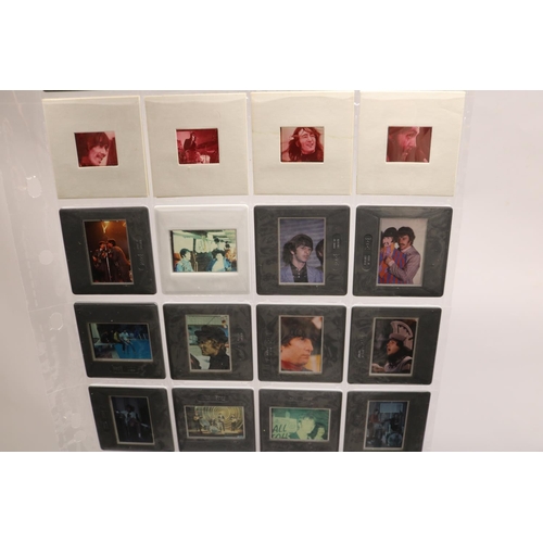 325B - Beatles - folder cont. 111 35mm plastic photo transparencies relating to the Beatles,