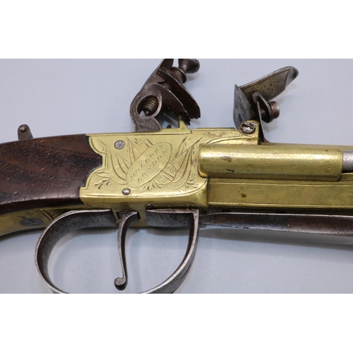 603 - W.Parker of Holborn London Flintlock coat pistol, with brass action and staged cannon barrel with sl... 